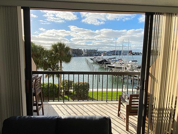 Dolphins love to stop by to say hi. 2nd floor unit with nice western sunny open balcony with beautiful water and boat views. Treasure Island view too.