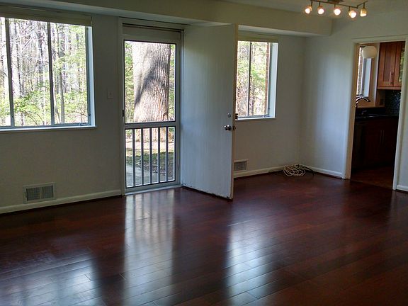 Living room with backdoor open to patio
