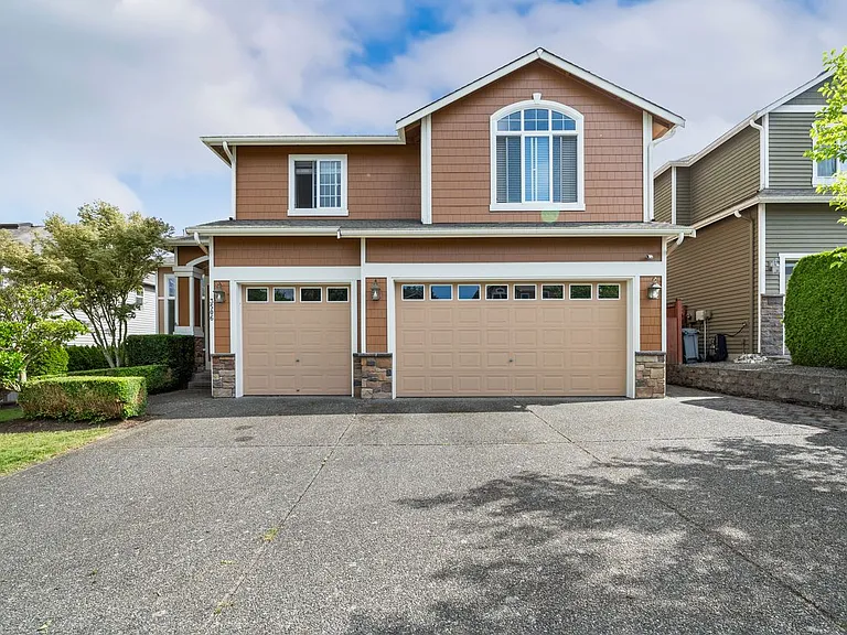 Front of house ft 3-car garage