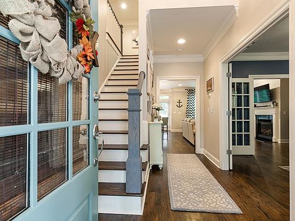 Two story foyer welcomes you.