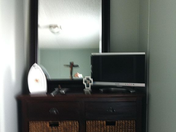 Dresser in master bedroom with TV