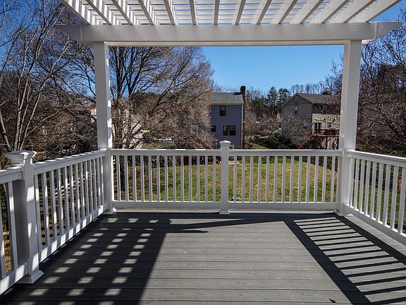 View from upper deck w/pergola looking out into the common area and neighborhood.