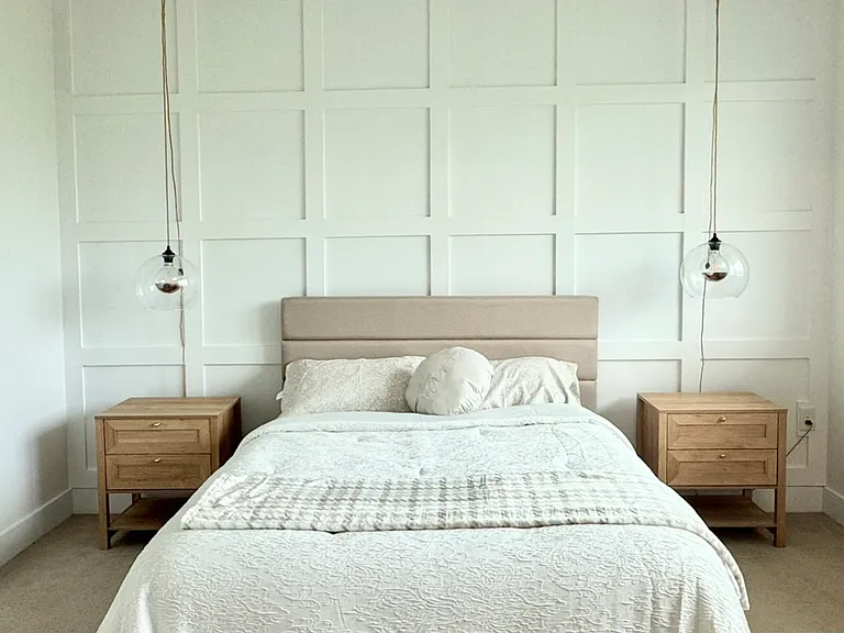 Bedroom - Queen size bed with sheets and pillows.