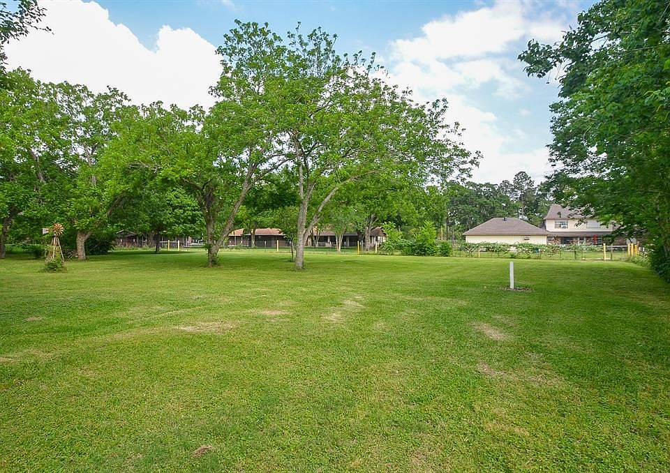 One full acre, loaded with fruit trees and pecan trees.