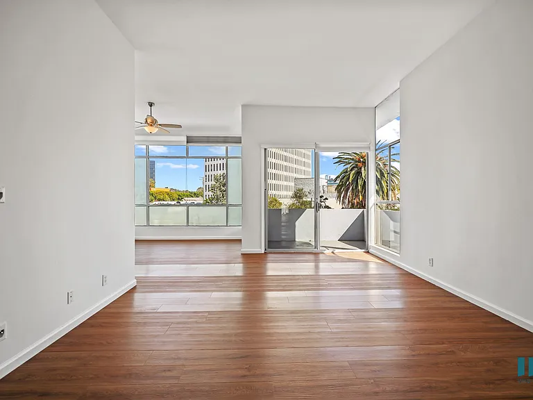 Spacious Open-Concept Living Room, Dining Area, and Patio