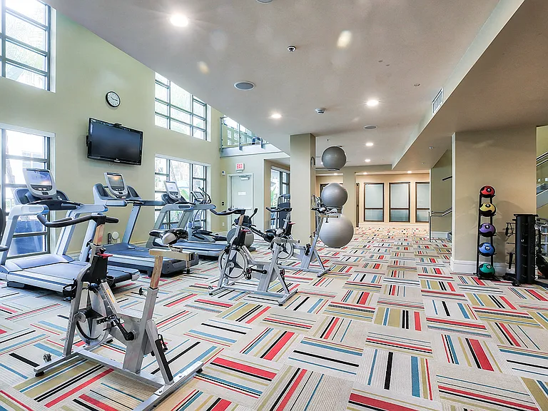 Train in our expansive fitness center featuring a Peloton bike and TRX