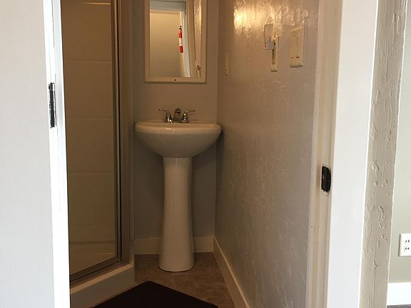 Bathroom view from hallway: showing vanity