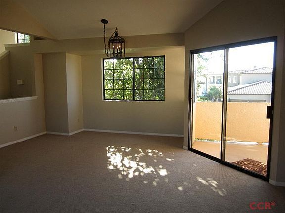 Livingroom looking onto dinning area and patio