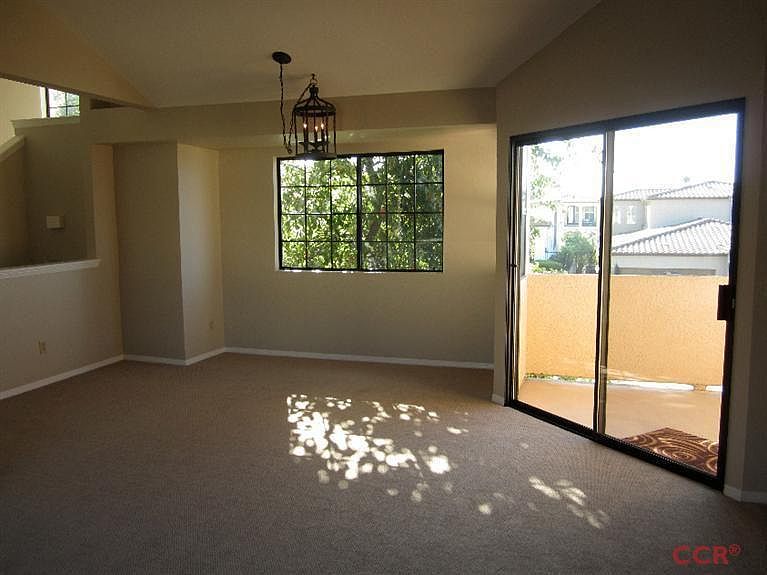 Livingroom looking onto dinning area and patio