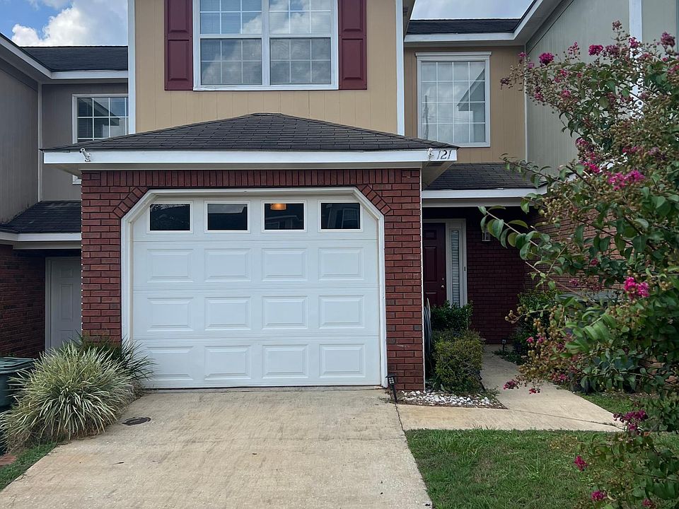 Driveway provides enough space for two average-sized vehicles to be park comfortably.