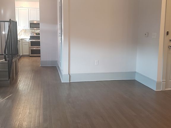 View of front door in studio. Kitchen to the left.