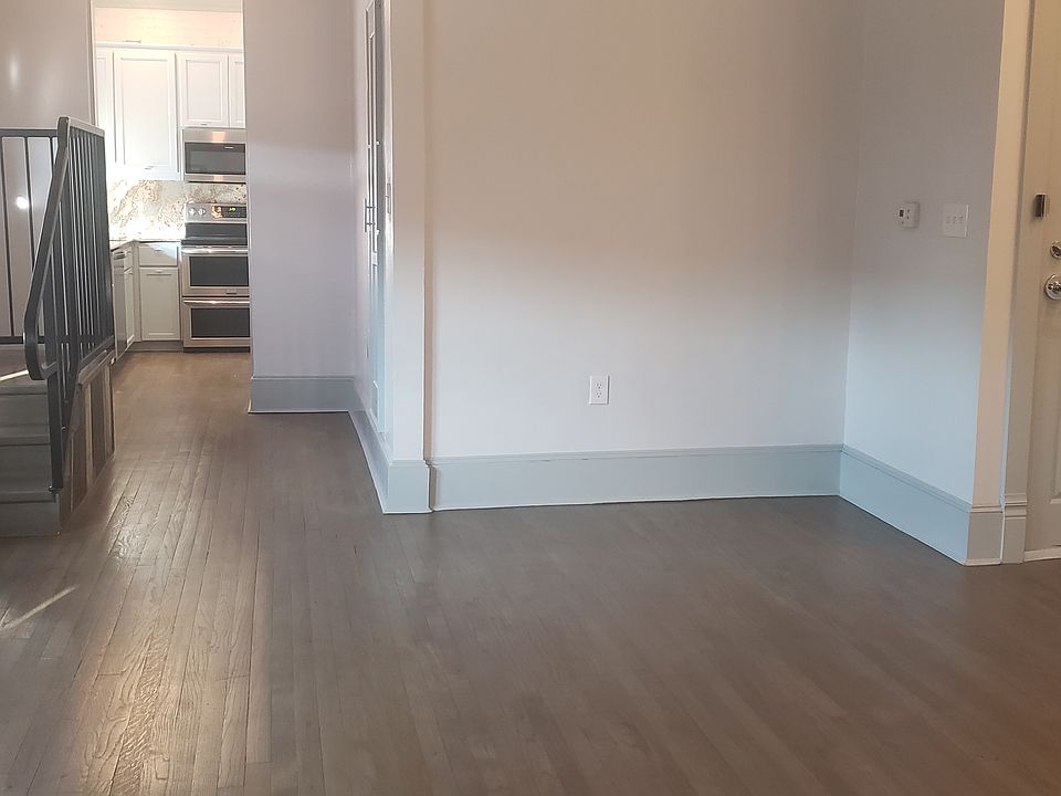 View of front door in studio. Kitchen to the left.