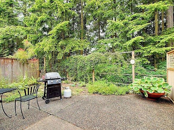 Enjoy sipping your favorite beverage and listening to the sweet song of birds out on the large patio