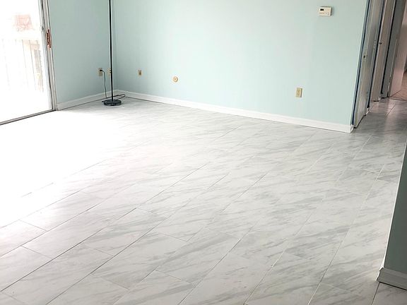 Continuation of the oversized and sunny living room.