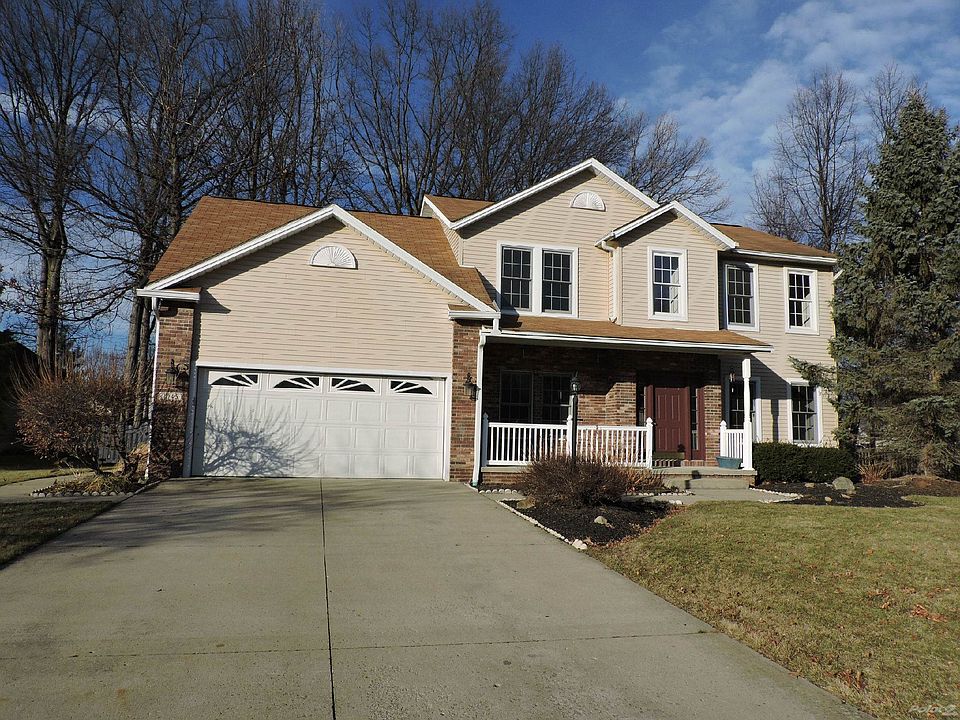 Colonial with 2 car attached garage & covered front porch
