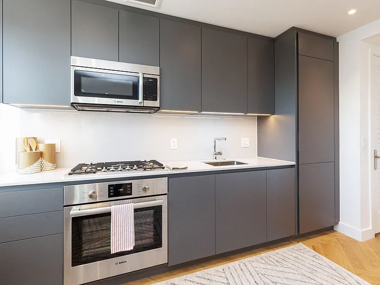 The Stanton studio apartment kitchen with quartz countertops