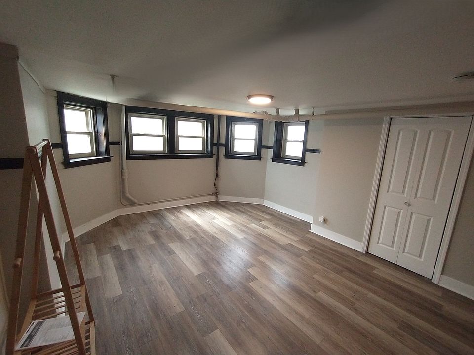 Very large bedroom - comfortable fits a Queen size bed and multiple dressers and mirror