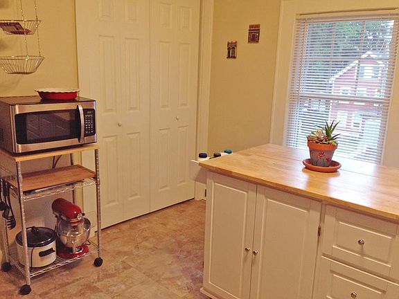 Kitchen with previous tenants furnishings