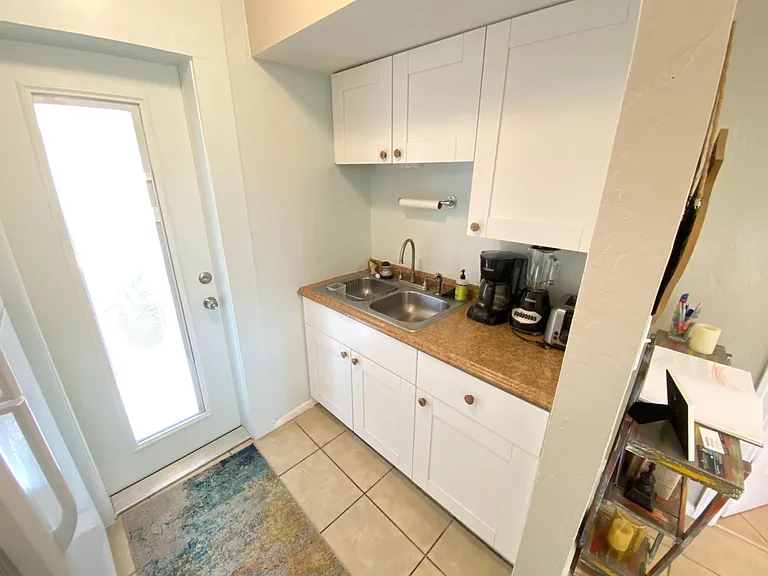 Kitchen (galley style) door is to porch