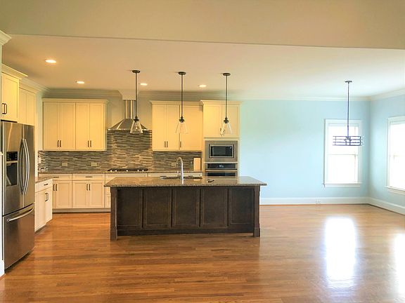 Jennair appliances. Lots of cabinets. Center island.