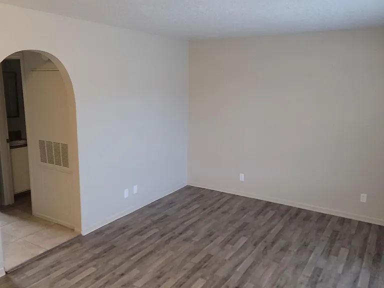 Niced sized living room with large window for plenty of natural light