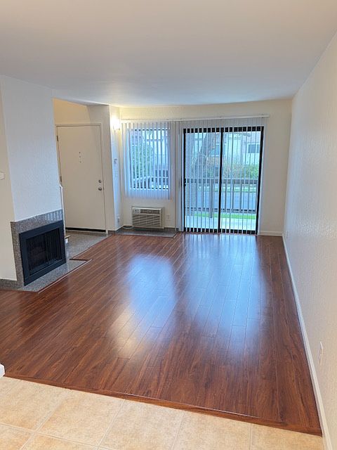 Living room with balcony and gas fireplace. Connects to breakfast nook.