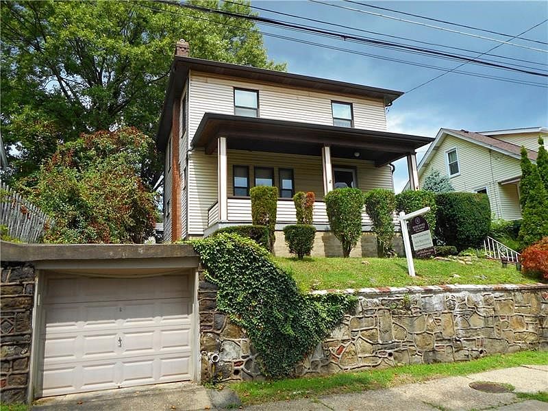 Exterior Front and Detached Garage: Welcome home to 4020 Davis Ave in upper Munhall. This home is just a short stroll to the sho