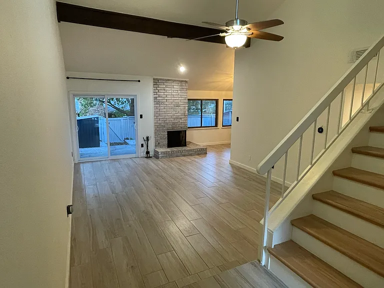 porcelain tile floors with real oak stairway