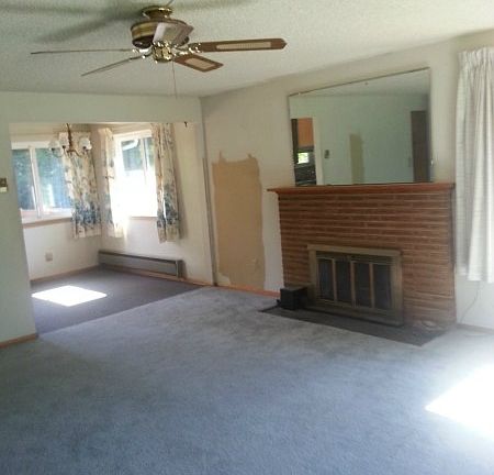 Hardwoods under the carpet, wood burning fireplace