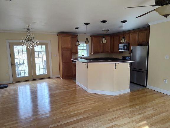 Kitchen with washer, convection oven wall microwave and plenty of storage for creating gourmet foods.