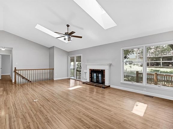 Great room with gas fireplace looks directly into the backyard.