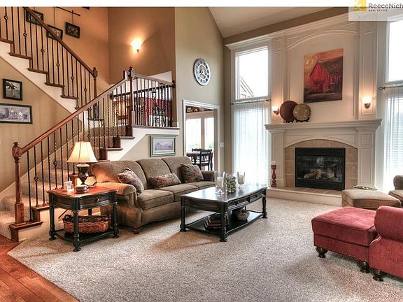 Large great room with fireplace and vaulted ceiling