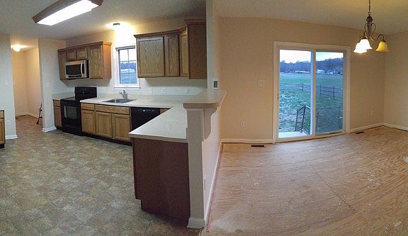 Kitchen and Dining Room
						:
						Large Kitchen with plenty of space for an eat in unit or island.