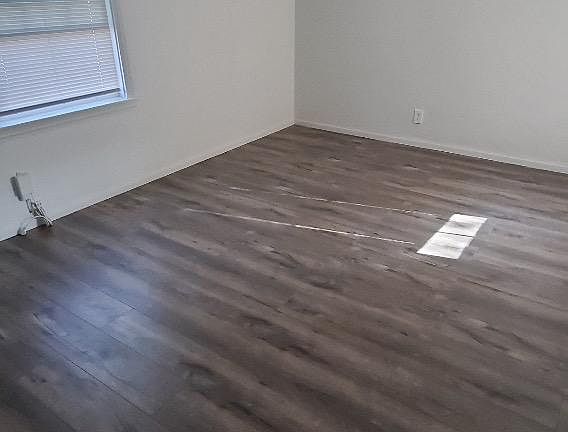 A good size bedroom overlooking the serene backyard