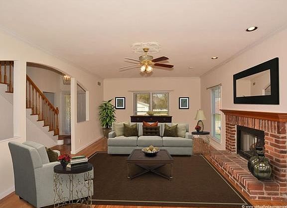 Living Room with gas fireplace. This photo is virtually staged.