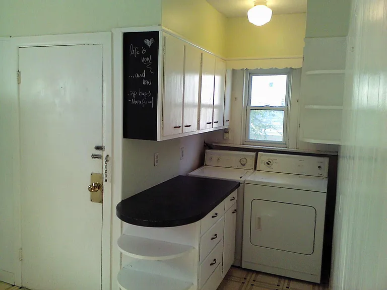 Laundry is being remodeled. Base cabinet is replaced with cabinet cart, hardwood floors restored.