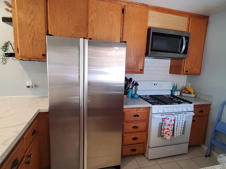 JenAir refrigerator & microwave with exhaust fan above the stove, New subway tile backsplash