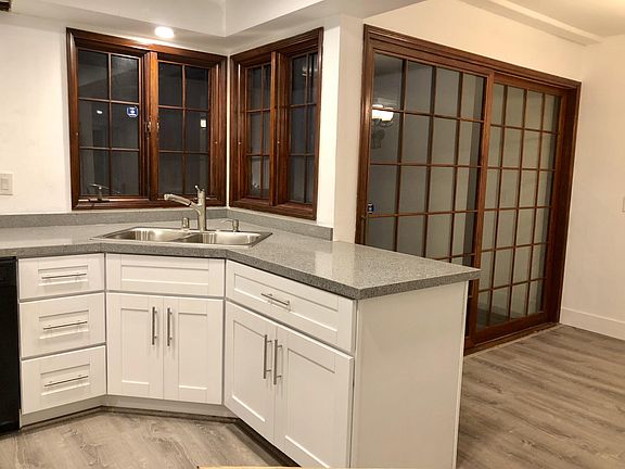 Kitchen, dining area and back balcony