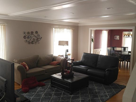 Living room with dining room in background