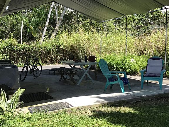 Covered back lanai offers a private, quiet spot. Outdoor kitchen possibilites.