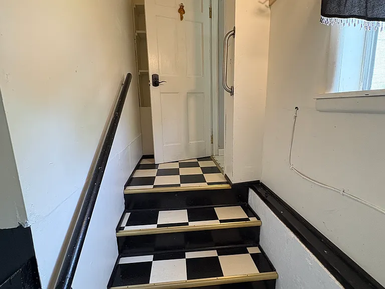 Basement Stairs - door into Utility Room