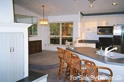 Fireplace, living room, dining area : See through fireplace divided dining room and living area