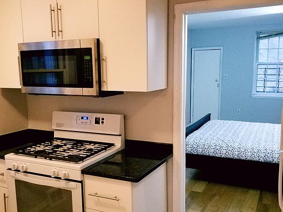 Gas Range with view into bedroom/back patio