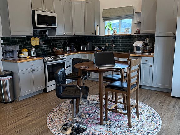 Floor level view of open concept ground floor in kitchen and dining room