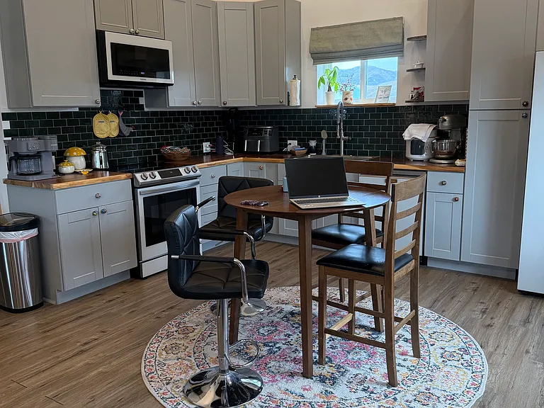Floor level view of open concept ground floor in kitchen and dining room