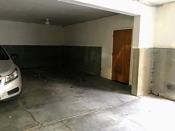 covered assigned parking w/ storage
