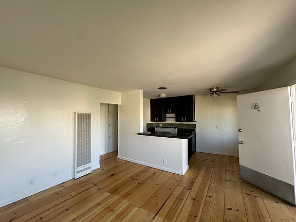 Living room into kitchen and eating area.