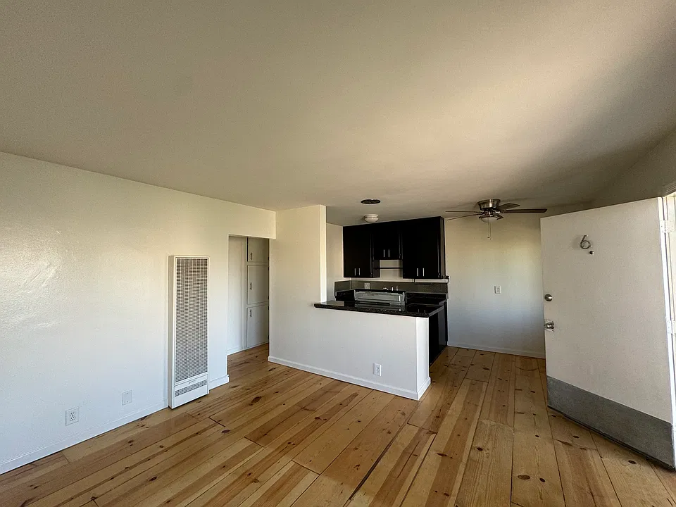 Living room into kitchen and eating area.
