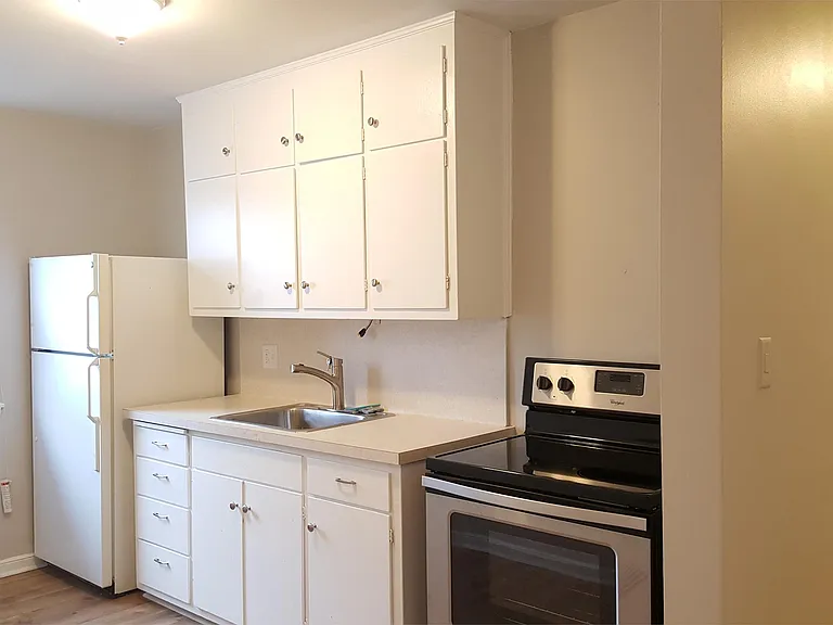Kitchen with nearly new stove and fridge