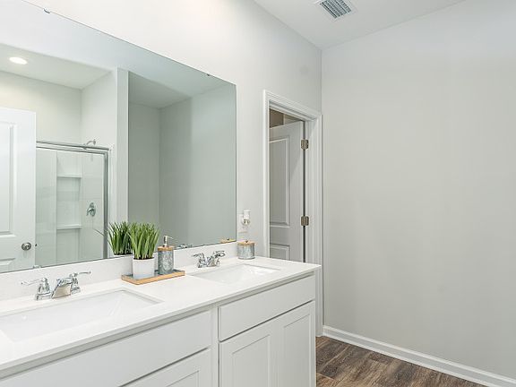 Owner s suite bath with spacious walk-in closet - Model Representation